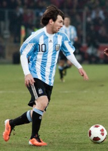 Lionel Messi (L), Bruno Alves (R)